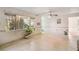 Sun-drenched living room with polished floors and a large window view at 440 Redwood Rd, Venice, FL 34293