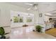 Open living room layout, featuring polished floors and access to the kitchen at 440 Redwood Rd, Venice, FL 34293