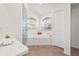 Bright bathroom featuring a separate glass shower and garden tub with large windows at 4449 Greenfield Ave, Sarasota, FL 34233