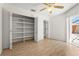 Bedroom with a closet and sliding glass door access to the pool area at 4449 Greenfield Ave, Sarasota, FL 34233