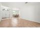 Well-lit dining area with a formal table set and a double-door entrance at 4449 Greenfield Ave, Sarasota, FL 34233