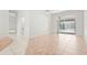 Spacious room with tile floors, sliding doors, and neutral paint at 4449 Greenfield Ave, Sarasota, FL 34233