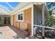 Detailed exterior showing a tile design, outdoor shower, and covered patio area at 4449 Greenfield Ave, Sarasota, FL 34233