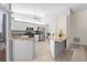 Open kitchen with stainless appliances, granite countertops and breakfast bar, perfect for entertaining at 4449 Greenfield Ave, Sarasota, FL 34233