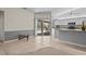 Bright kitchen and breakfast bar flow into a sunroom and lanai, offering seamless indoor-outdoor living at 4449 Greenfield Ave, Sarasota, FL 34233
