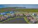 Aerial view of the beautiful homes by the lakes with lush greenery in the community at 5715 Inspiration Ter, Bradenton, FL 34210