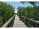 Charming boardwalk cutting through lush greenery at 5715 Inspiration Ter, Bradenton, FL 34210