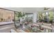 Entertain effortlessly on the lanai with a view of the lake, seating, and access to the interior living spaces at 5715 Inspiration Ter, Bradenton, FL 34210