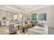 Spacious living room showcasing stylish furnishings, contemporary lighting, and an open layout at 5715 Inspiration Ter, Bradenton, FL 34210
