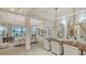 Spacious living room featuring modern decor and furnishings, and large windows with a view at 5715 Inspiration Ter, Bradenton, FL 34210