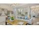 Bright living room with modern furnishings, neutral tones and unique artwork at 5715 Inspiration Ter, Bradenton, FL 34210
