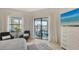 Well-lit main bedroom with lanai access offers a peaceful retreat with a calming water view at 5715 Inspiration Ter, Bradenton, FL 34210