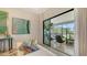 Bright sitting area featuring a comfortable daybed, large windows, and stylish artwork at 5715 Inspiration Ter, Bradenton, FL 34210