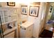 Bathroom with a vanity, framed artwork, and a stylish mirror, complemented by warm, natural light at 5888 17Th W St # C23, Bradenton, FL 34207