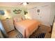 Inviting bedroom with warm colors, a queen bed, and natural light streaming through the window at 5888 17Th W St # C23, Bradenton, FL 34207
