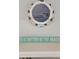 Coastal-themed decor featuring a porthole-style picture frame and a sign that reads, 