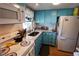 Bright kitchen with granite countertop and white appliances at 5888 17Th W St # C23, Bradenton, FL 34207