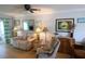 Cozy living room features a ceiling fan, sofa, recliner and nice decor at 5888 17Th W St # C23, Bradenton, FL 34207