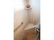 Shower with a grab bar, and a built-in seat, featuring decorative tiles and a clear glass door at 5888 17Th W St # C23, Bradenton, FL 34207