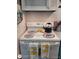 Close-up of a clean white stove, complete with decorative towels, adding a homey touch to the kitchen at 5888 17Th W St # C23, Bradenton, FL 34207