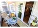 Bright sunroom featuring comfortable seating, a mosaic table, and lots of natural light from sliding glass doors at 5888 17Th W St # C23, Bradenton, FL 34207