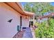 Quaint front entrance with a stone pathway and vibrant, lush landscaping at 6414 Sun Eagle Ln, Bradenton, FL 34210