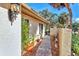 Attractive walkway lined with potted plants, leading to the entrance of this lovely home at 6414 Sun Eagle Ln, Bradenton, FL 34210