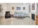 Bright living room featuring a fireplace, comfortable seating, and artwork, creating a relaxing atmosphere at 6414 Sun Eagle Ln, Bradenton, FL 34210