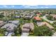 Beautiful aerial view of a neighborhood with lush landscaping and serene water features at 6532 Coopers Hawk Ct, Lakewood Ranch, FL 34202