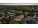 Scenic aerial image featuring lush green trees and a beautiful community at sunset at 6532 Coopers Hawk Ct, Lakewood Ranch, FL 34202