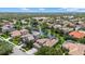 Expansive aerial view of community featuring picturesque water views and lush surroundings at 6532 Coopers Hawk Ct, Lakewood Ranch, FL 34202
