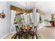 Dining area by the pool area, with a table and chairs with natural light at 6532 Coopers Hawk Ct, Lakewood Ranch, FL 34202