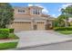 Stunning two-story home features a three-car garage, well-manicured lawn and tile roof at 6532 Coopers Hawk Ct, Lakewood Ranch, FL 34202