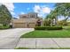 Stately two-story home with manicured landscaping and a three-car garage at 6532 Coopers Hawk Ct, Lakewood Ranch, FL 34202