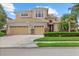 Beautiful two-story home featuring a three-car garage, well-manicured lawn and tile roof at 6532 Coopers Hawk Ct, Lakewood Ranch, FL 34202