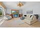 Cozy living room with comfortable seating and entertainment center at 6532 Coopers Hawk Ct, Lakewood Ranch, FL 34202