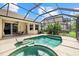 Backyard pool and spa features a screened enclosure, a patio, and landscaping at 6532 Coopers Hawk Ct, Lakewood Ranch, FL 34202