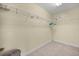 Walk-in closet with carpet flooring and wire shelving throughout at 6532 Coopers Hawk Ct, Lakewood Ranch, FL 34202