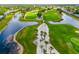 Aerial view of the community's lush golf course, lakes, and winding pathways at 6940 W Country Club N Dr # V-77, Sarasota, FL 34243