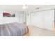 Bright bedroom with tile flooring, a ceiling fan, and a large closet with sliding doors at 6940 W Country Club N Dr # V-77, Sarasota, FL 34243