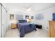 Cozy bedroom with ceiling fan, natural light, and neutral decor at 6940 W Country Club N Dr # V-77, Sarasota, FL 34243