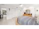Cozy bedroom featuring neutral tones, tile floors, and a ceiling fan at 6940 W Country Club N Dr # V-77, Sarasota, FL 34243