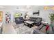 Comfortable living room showcasing tile floors, neutral walls, and stylish modern sofas at 6940 W Country Club N Dr # V-77, Sarasota, FL 34243