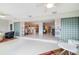 Open-concept living space with bright tile and a view into the kitchen and living room at 6940 W Country Club N Dr # V-77, Sarasota, FL 34243