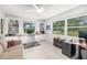 Bright office with built-in bookcases, two windows, and a tile floor at 6940 W Country Club N Dr # V-77, Sarasota, FL 34243