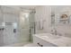 Bathroom features a stylish marble-look shower with glass door, modern fixtures, and a sleek vanity at 6951 Gulf Of Mexico Dr # 14, Longboat Key, FL 34228