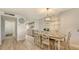 Dining area with wooden table and view of kitchen at 6951 Gulf Of Mexico Dr # 14, Longboat Key, FL 34228