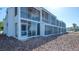 Screened balconies offer tranquil outdoor living space with views of the surrounding landscape at 6951 Gulf Of Mexico Dr # 14, Longboat Key, FL 34228