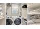 Convenient laundry area equipped with Samsung washer/dryer and ample shelving for storage at 6951 Gulf Of Mexico Dr # 14, Longboat Key, FL 34228