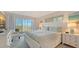 Bright bedroom features a large sliding glass door with beach views at 6951 Gulf Of Mexico Dr # 14, Longboat Key, FL 34228
